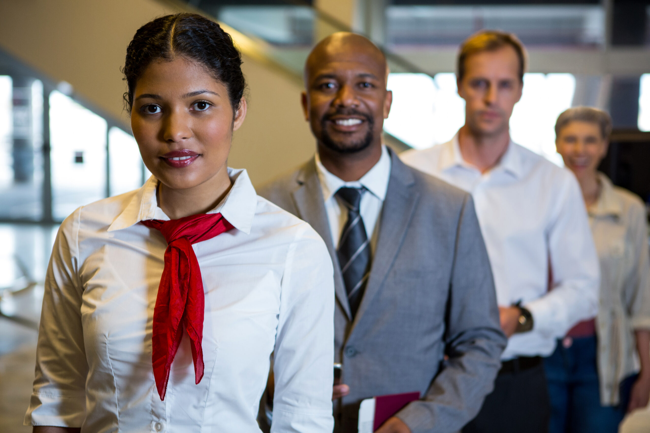 Travel staff assisting passengers